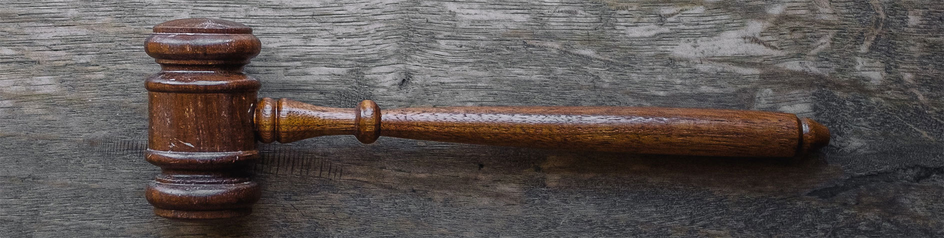 Wooden gavel lies on a table